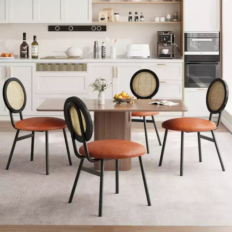 Modern upholstered dining chairs  Contemporary set with natural rattan backrest, metal legs  Space-saving design for dining room