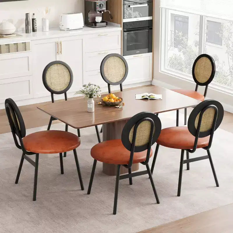 Modern upholstered dining chairs  Contemporary set with natural rattan backrest, metal legs  Space-saving design for dining room