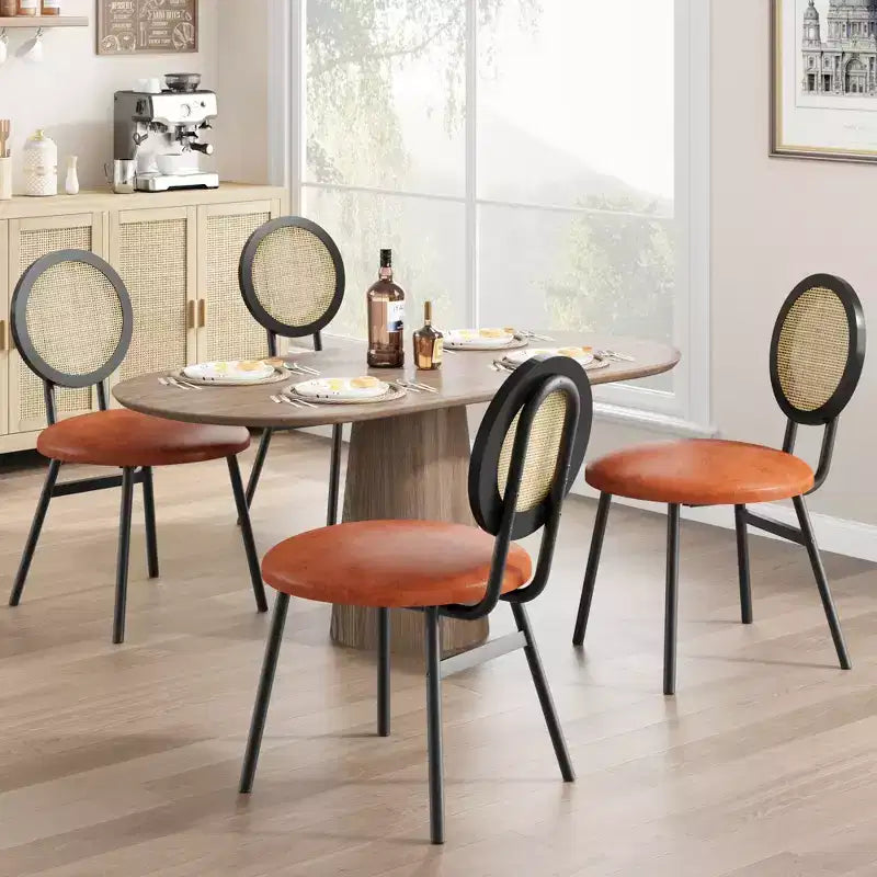 Modern upholstered dining chairs  Contemporary set with natural rattan backrest, metal legs  Space-saving design for dining room
