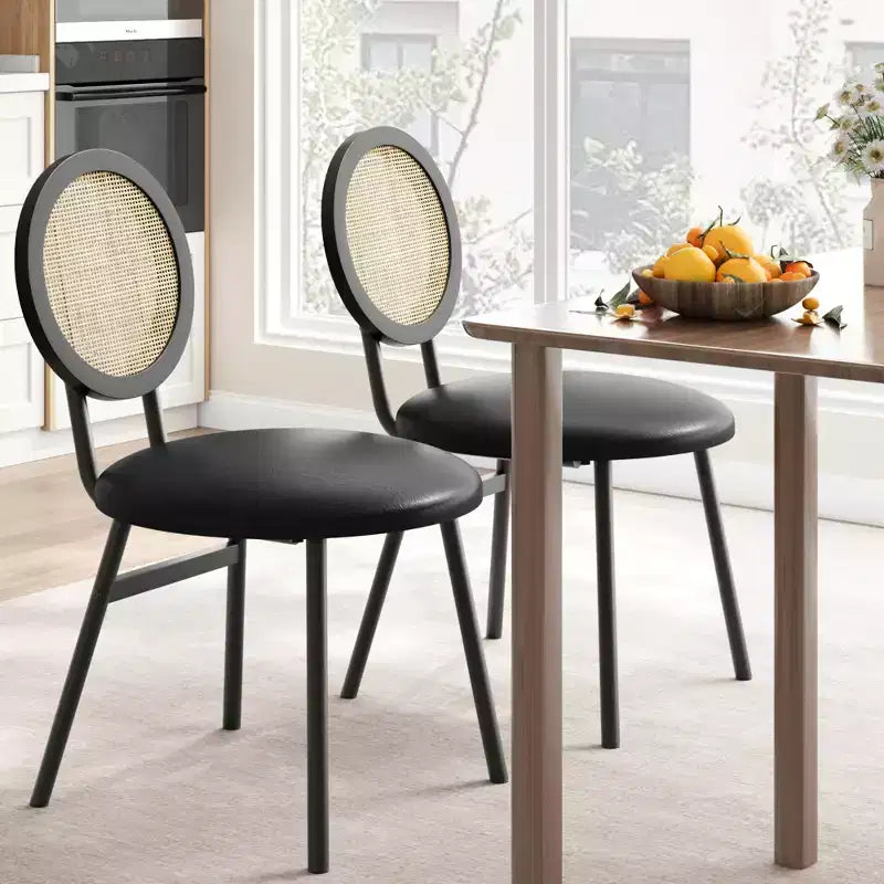 Modern upholstered dining chairs  Contemporary set with natural rattan backrest, metal legs  Space-saving design for dining room