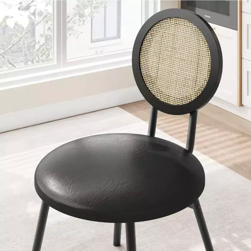 Modern upholstered dining chairs  Contemporary set with natural rattan backrest, metal legs  Space-saving design for dining room
