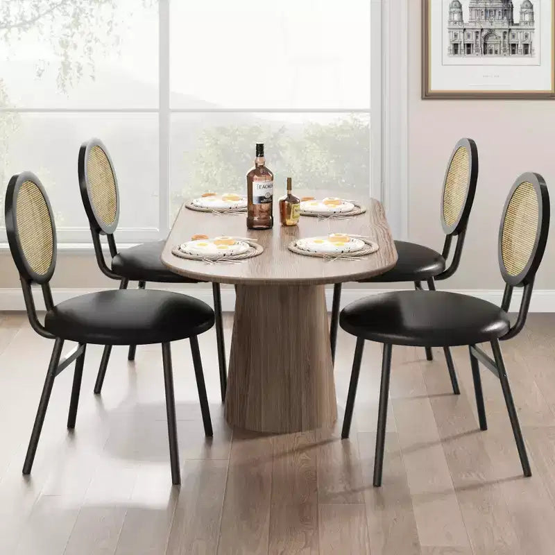 Modern upholstered dining chairs  Contemporary set with natural rattan backrest, metal legs  Space-saving design for dining room
