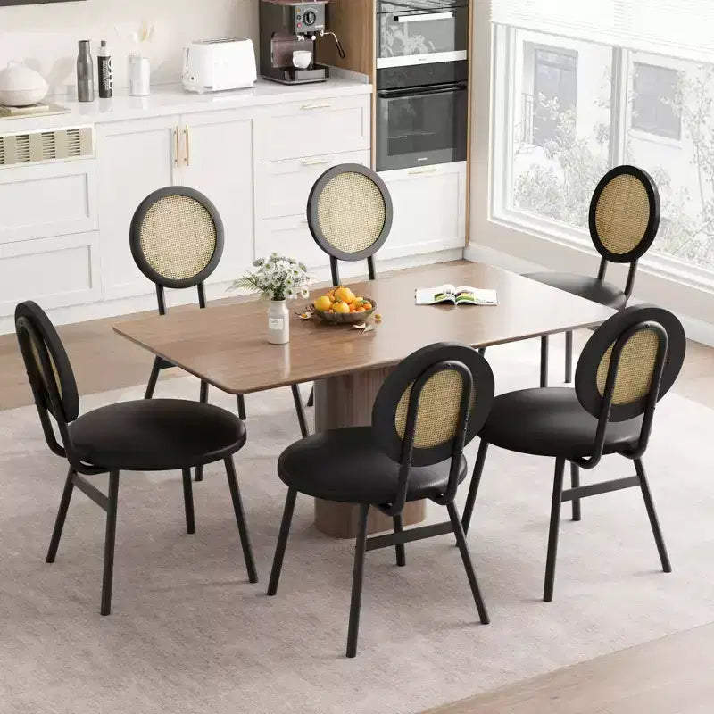 Modern upholstered dining chairs  Contemporary set with natural rattan backrest, metal legs  Space-saving design for dining room