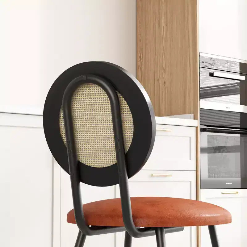 Modern upholstered dining chairs  Contemporary set with natural rattan backrest, metal legs  Space-saving design for dining room