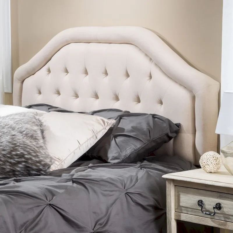 Testiera imbottita regolabile per letto a una piazza e mezza/matrimoniale con bottoni decorativi e gambe in ferro nero, design curvo