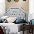 Testiera imbottita regolabile per letto a una piazza e mezza/matrimoniale con bottoni decorativi e gambe in ferro nero, design curvo