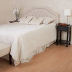 Testiera imbottita regolabile per letto a una piazza e mezza/matrimoniale con bottoni decorativi e gambe in ferro nero, design curvo