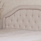 Testiera imbottita regolabile per letto a una piazza e mezza/matrimoniale con bottoni decorativi e gambe in ferro nero, design curvo